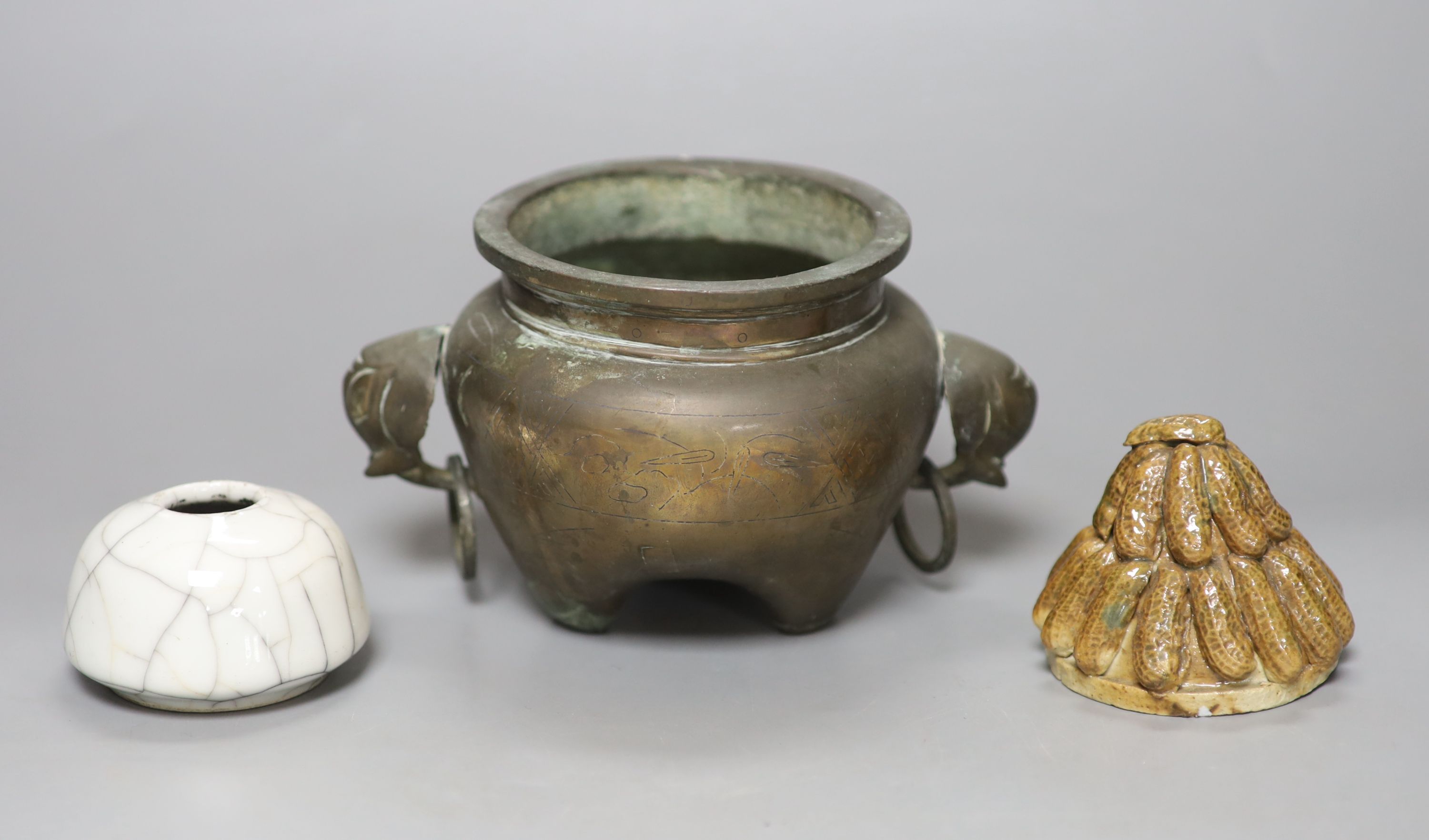 A Chinese bronze and silver inlaid tripod censer, c.1900, a stoneware cover and a crackleglaze inkwell, tallest 10cm